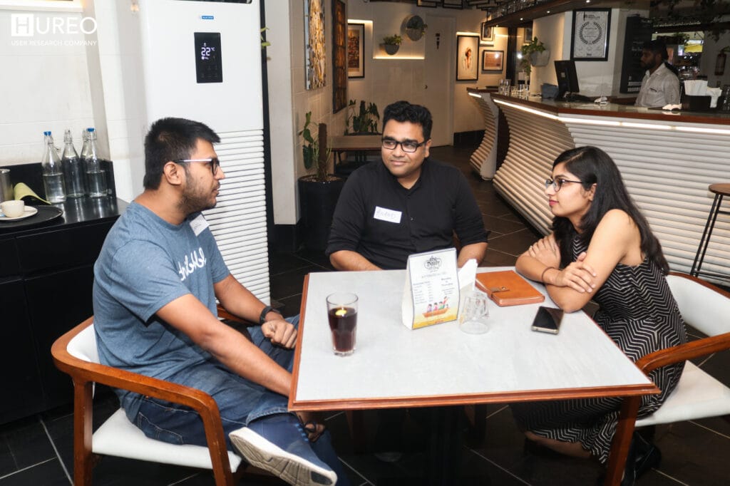 Arunima, a researcher at Hureo, chats with attendees